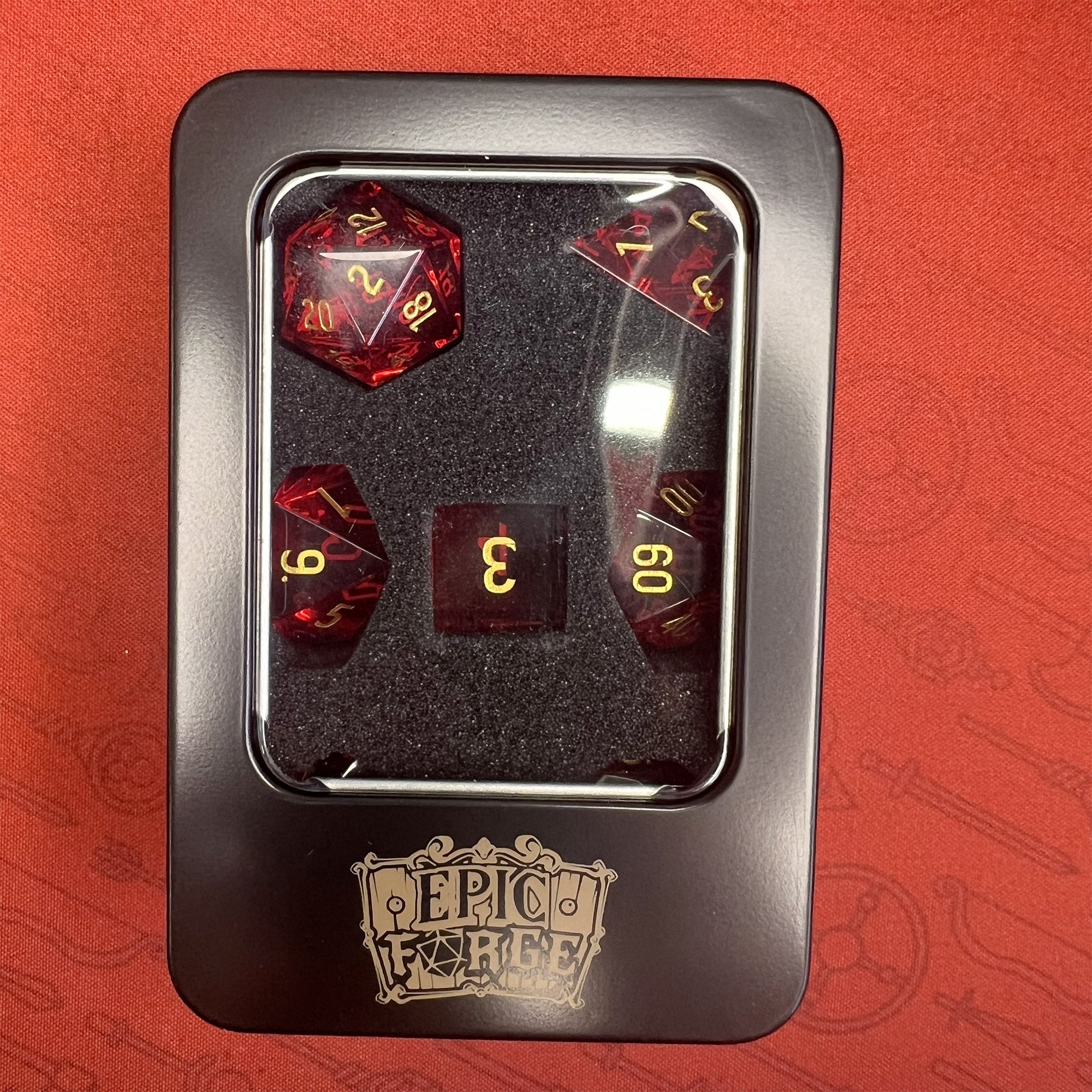 EPIC FORGE Glass dice - Set of 7 dice with metal box - color Red - Disponibile in 2/3 giorni lavorativi Trade Invaders